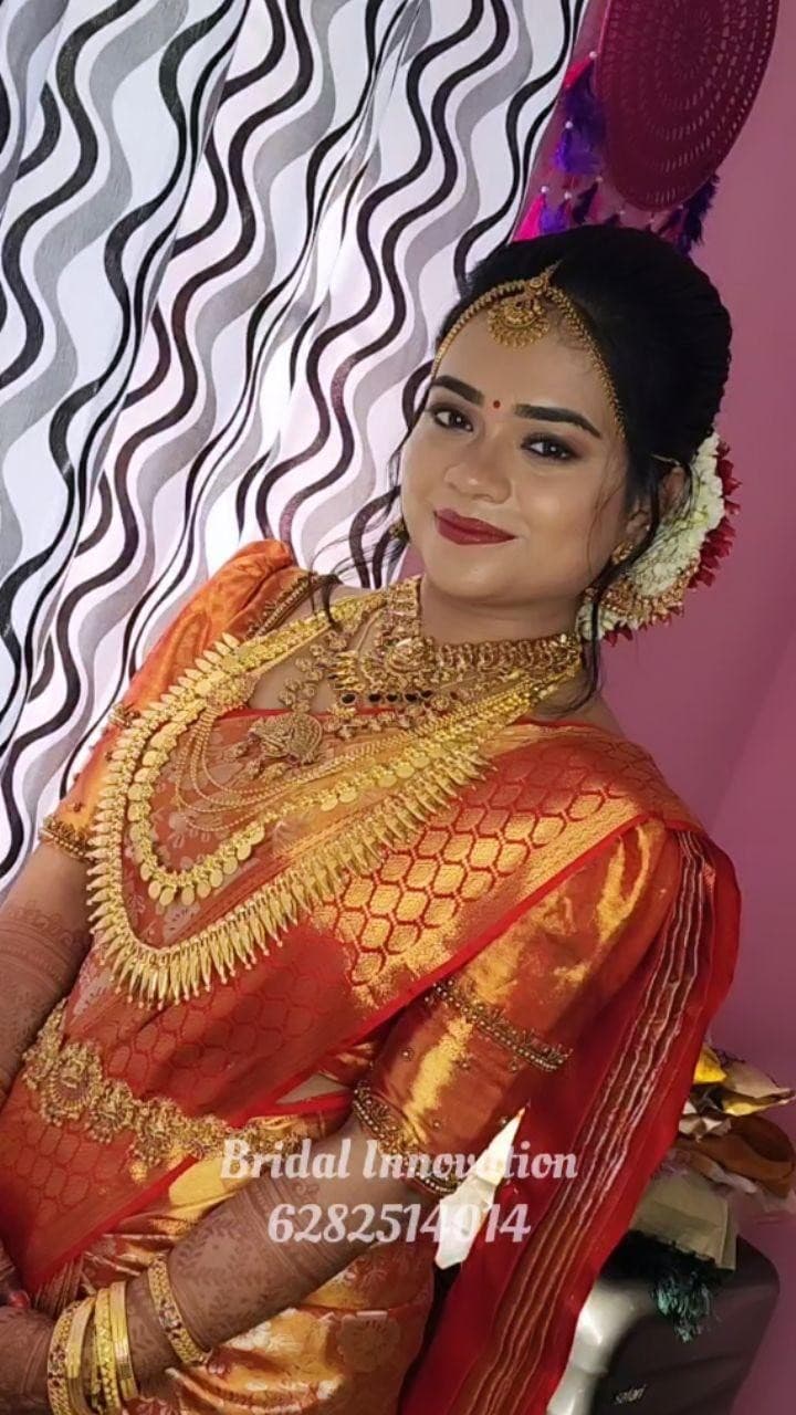 Bridal Innovation legacy portfolio look 1, showing Kerala bridal makeup, hair styling, saree, jewellery, or ceremony details.