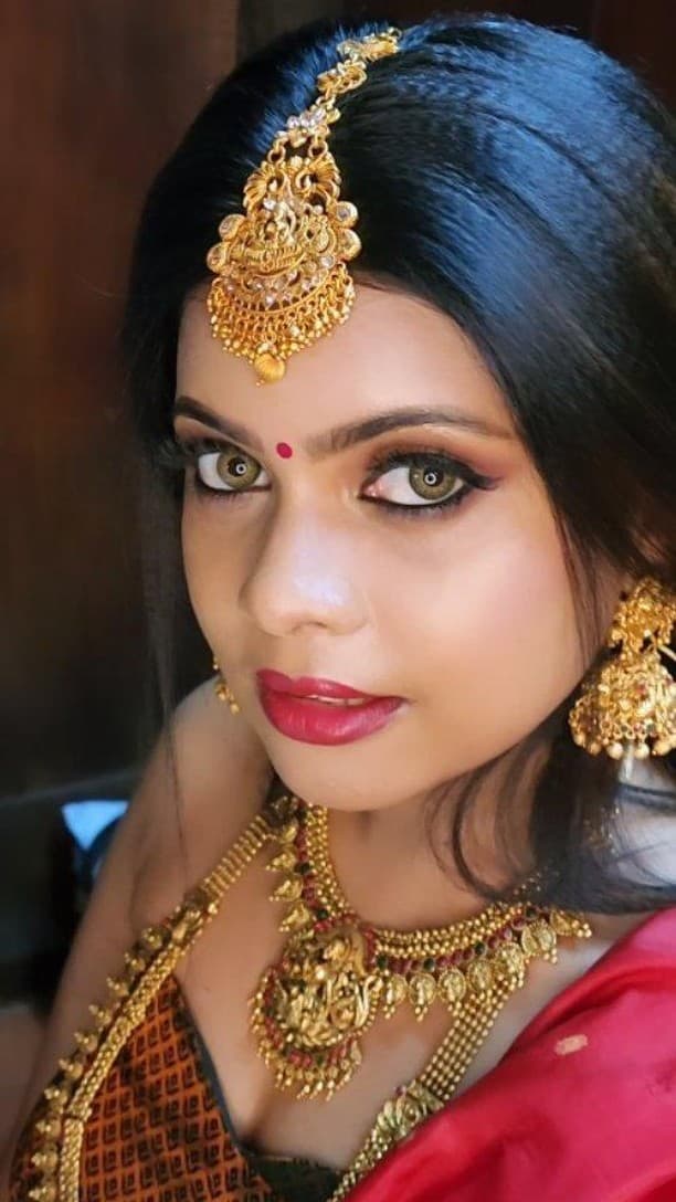 Bridal Innovation legacy portfolio look 2, showing Kerala bridal makeup, hair styling, saree, jewellery, or ceremony details.