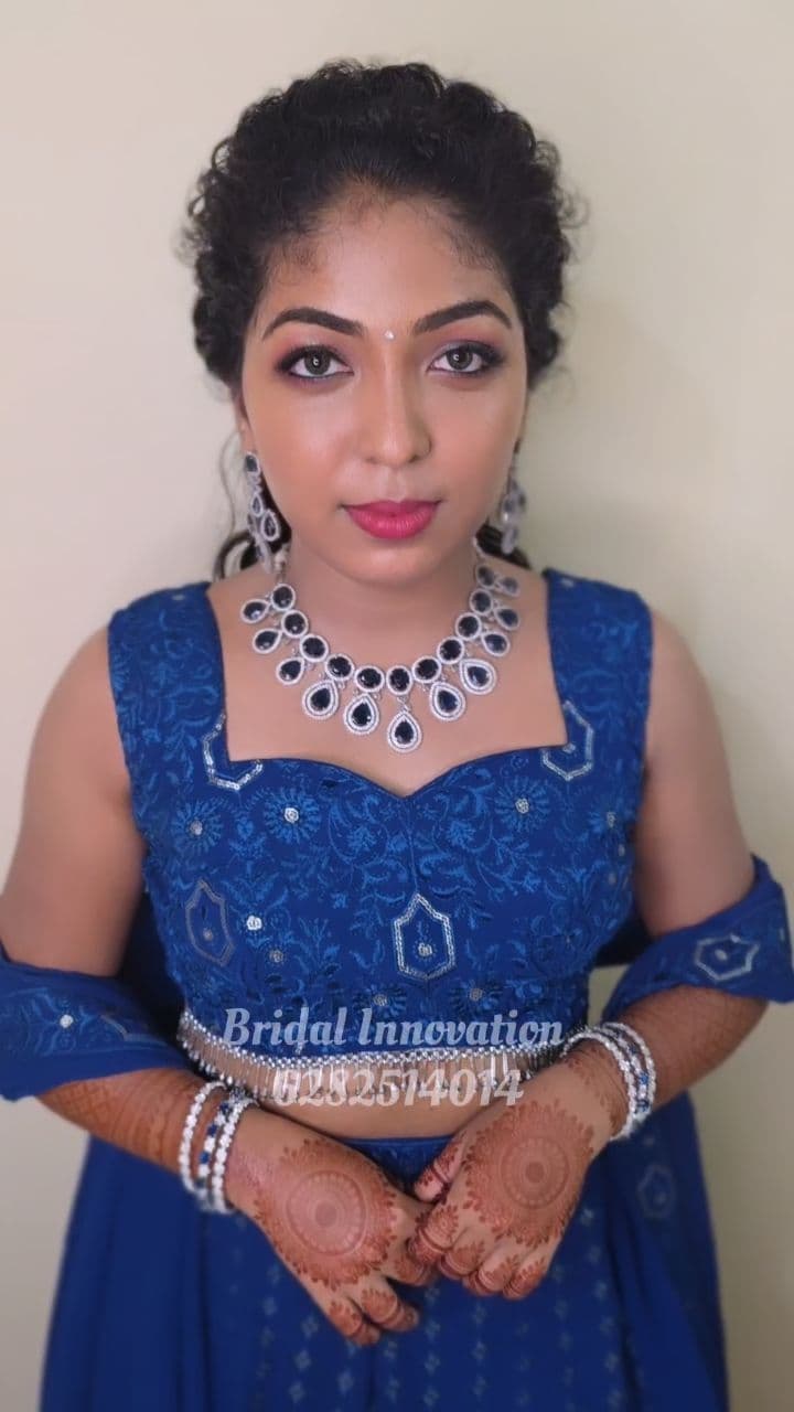 Bridal Innovation legacy portfolio look 12, showing Kerala bridal makeup, hair styling, saree, jewellery, or ceremony details.