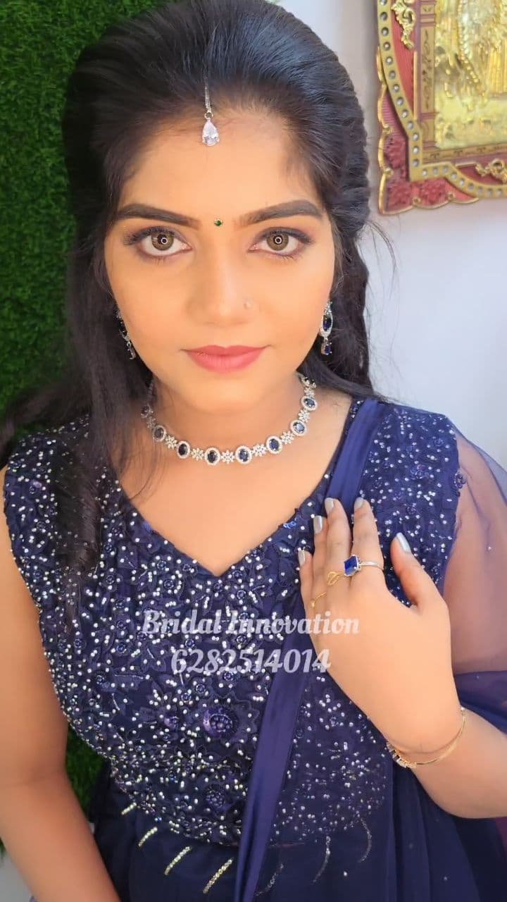 Bridal Innovation legacy portfolio look 15, showing Kerala bridal makeup, hair styling, saree, jewellery, or ceremony details.