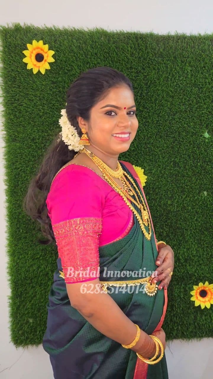 Bridal Innovation legacy portfolio look 19, showing Kerala bridal makeup, hair styling, saree, jewellery, or ceremony details.