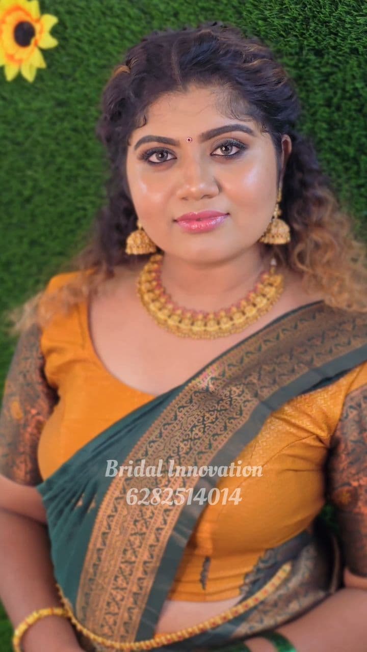 Bridal Innovation legacy portfolio look 21, showing Kerala bridal makeup, hair styling, saree, jewellery, or ceremony details.