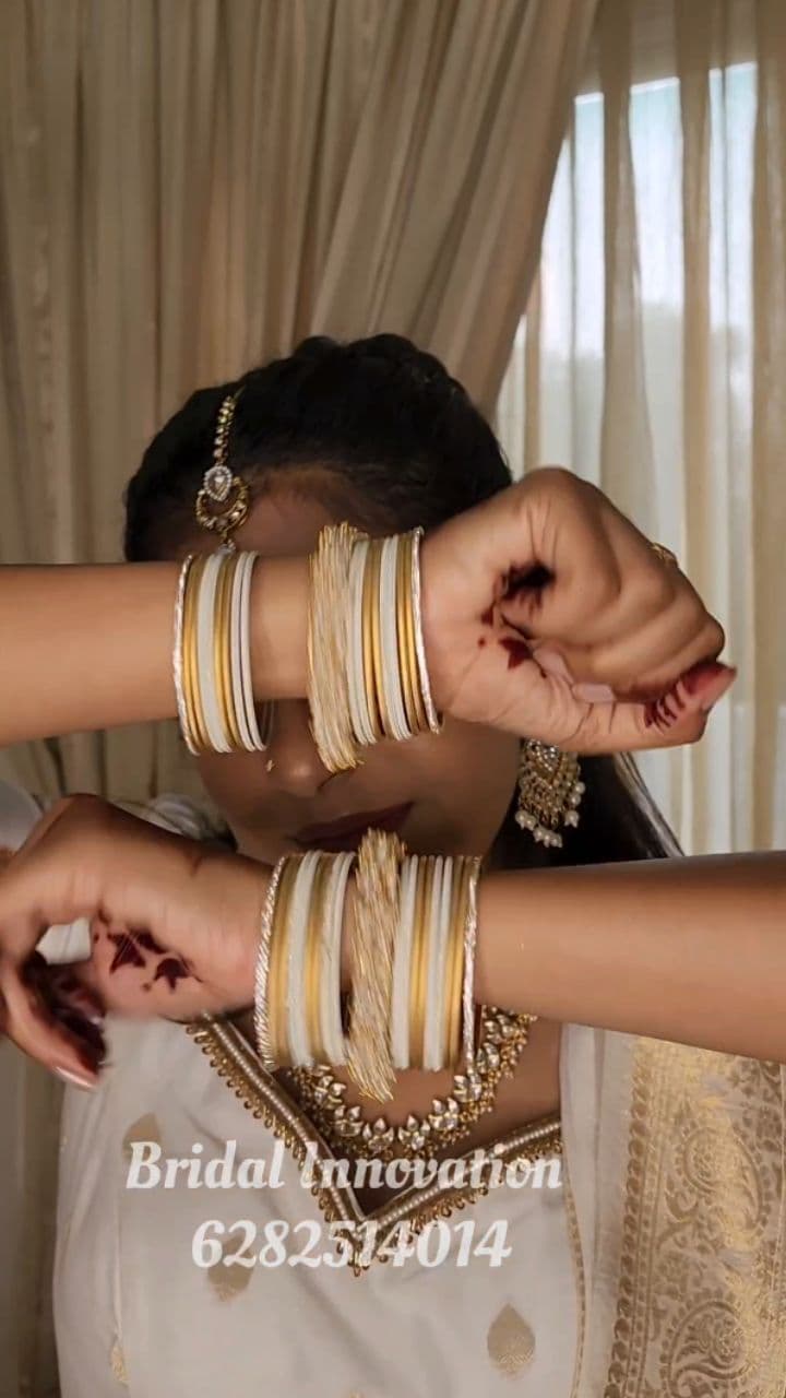 Bridal Innovation legacy portfolio look 23, showing Kerala bridal makeup, hair styling, saree, jewellery, or ceremony details.