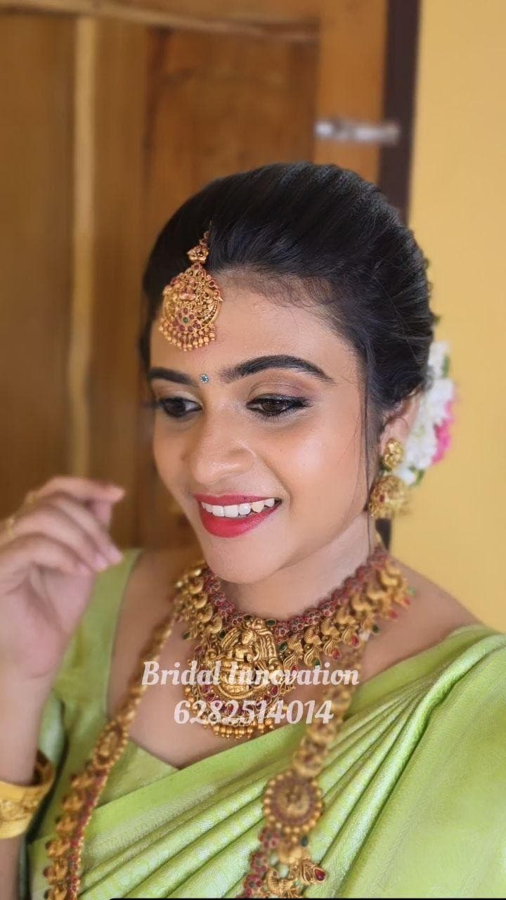 Bridal Innovation legacy portfolio look 29, showing Kerala bridal makeup, hair styling, saree, jewellery, or ceremony details.