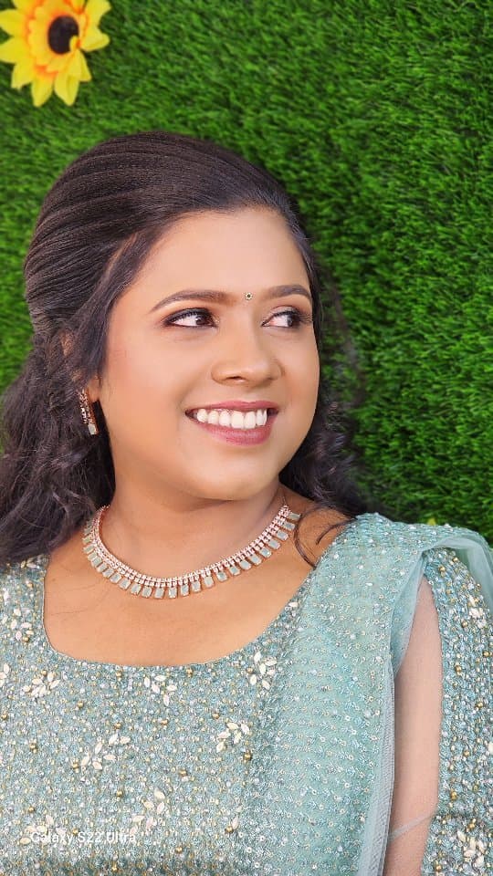 Bridal Innovation legacy portfolio look 35, showing Kerala bridal makeup, hair styling, saree, jewellery, or ceremony details.