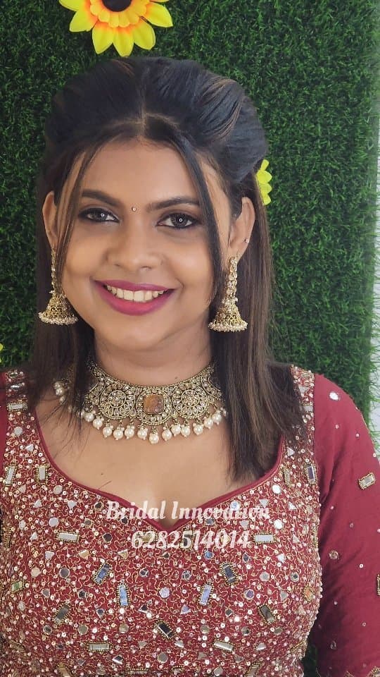 Bridal Innovation legacy portfolio look 40, showing Kerala bridal makeup, hair styling, saree, jewellery, or ceremony details.