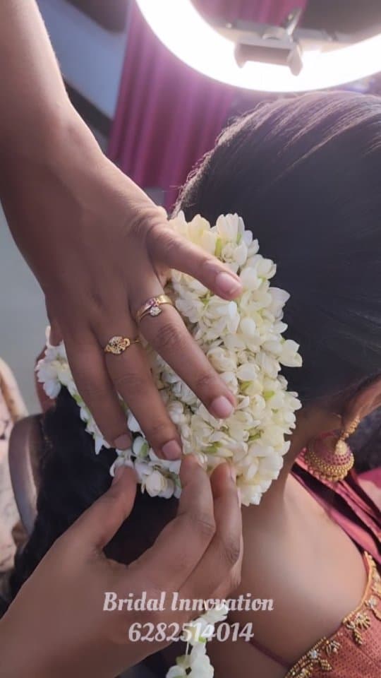 Bridal Innovation legacy portfolio look 41, showing Kerala bridal makeup, hair styling, saree, jewellery, or ceremony details.