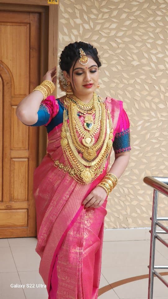 Bridal Innovation legacy portfolio look 43, showing Kerala bridal makeup, hair styling, saree, jewellery, or ceremony details.