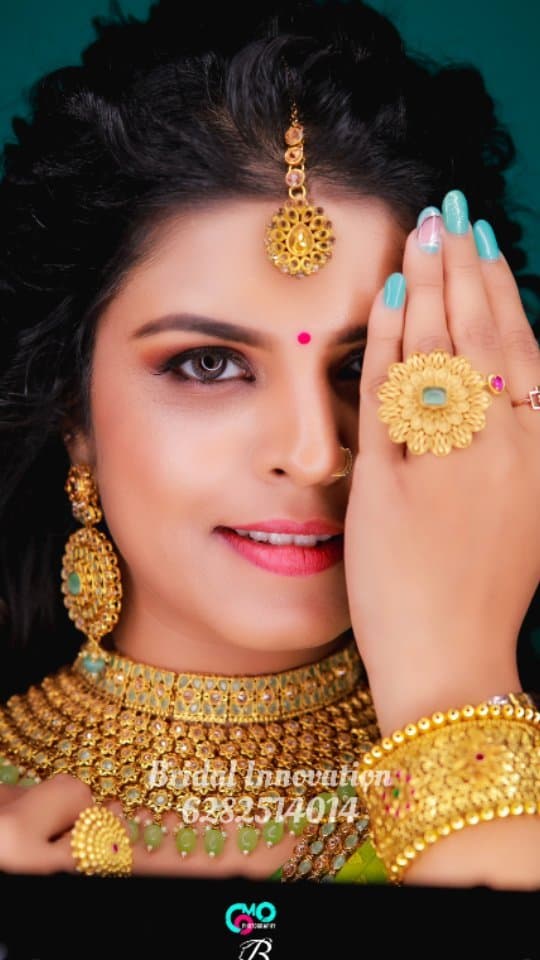 Bridal Innovation legacy portfolio look 51, showing Kerala bridal makeup, hair styling, saree, jewellery, or ceremony details.