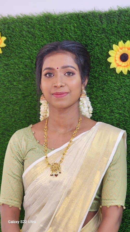 Bridal Innovation legacy portfolio look 57, showing Kerala bridal makeup, hair styling, saree, jewellery, or ceremony details.