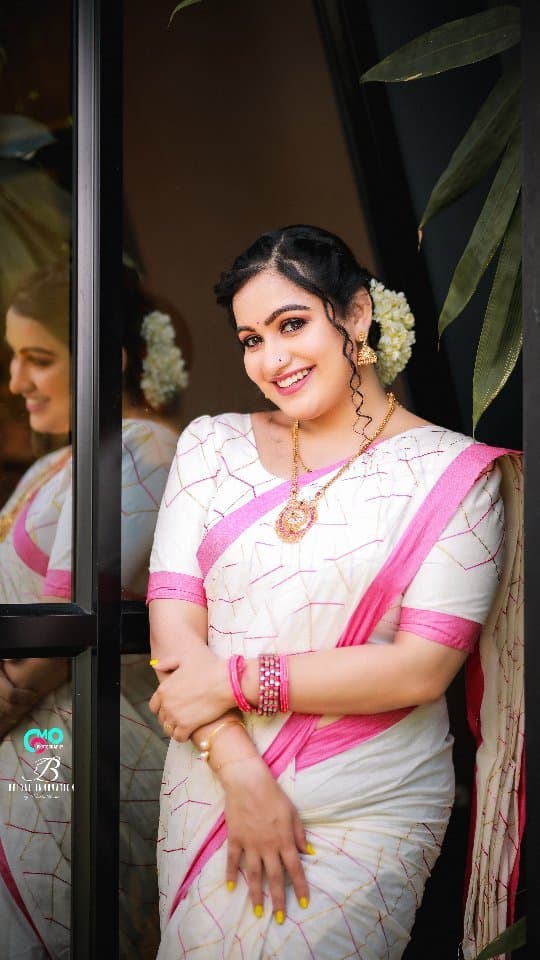 Bridal Innovation legacy portfolio look 58, showing Kerala bridal makeup, hair styling, saree, jewellery, or ceremony details.
