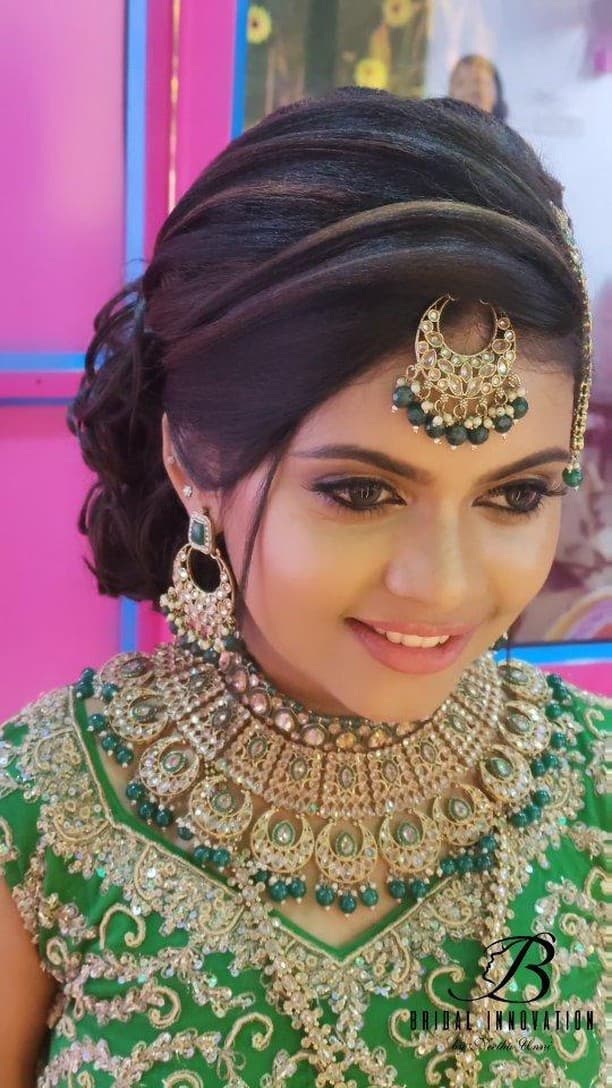 Bridal Innovation legacy portfolio look 61, showing Kerala bridal makeup, hair styling, saree, jewellery, or ceremony details.